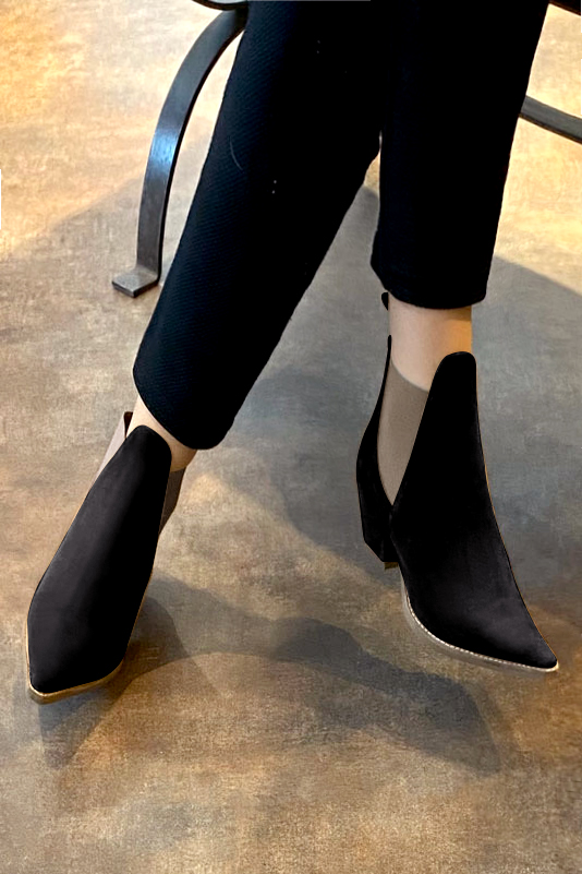 Matt black and taupe brown women's ankle boots, with elastics. Pointed toe. Medium cone heels. Worn view - Florence KOOIJMAN